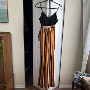 AKIRA Black and Orange Color-Block Jumpsuit with Stripes. Wide leg